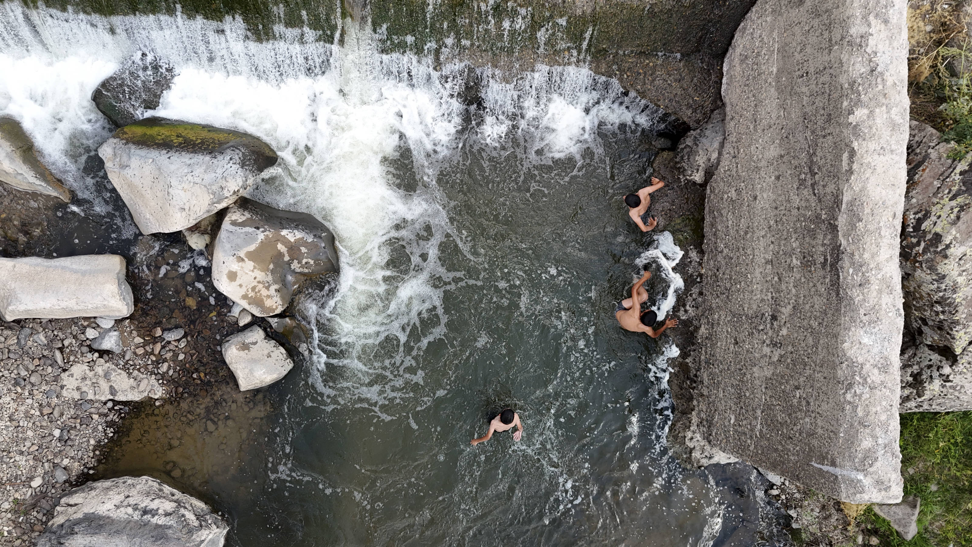 In a village in Ağrı in the east fo the country, children cool off by swimming in a stream