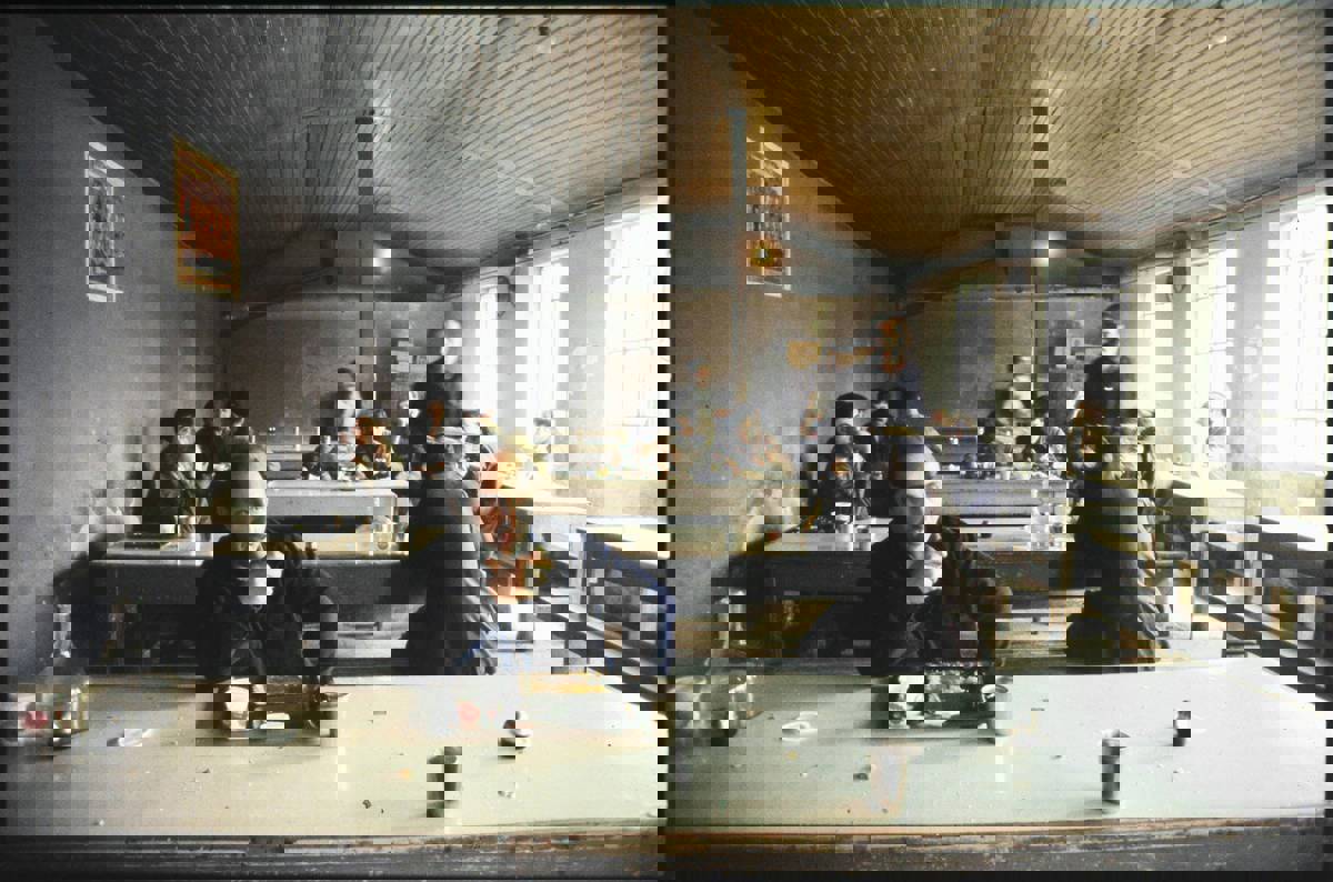 Leather workers at the dining hall of a factory