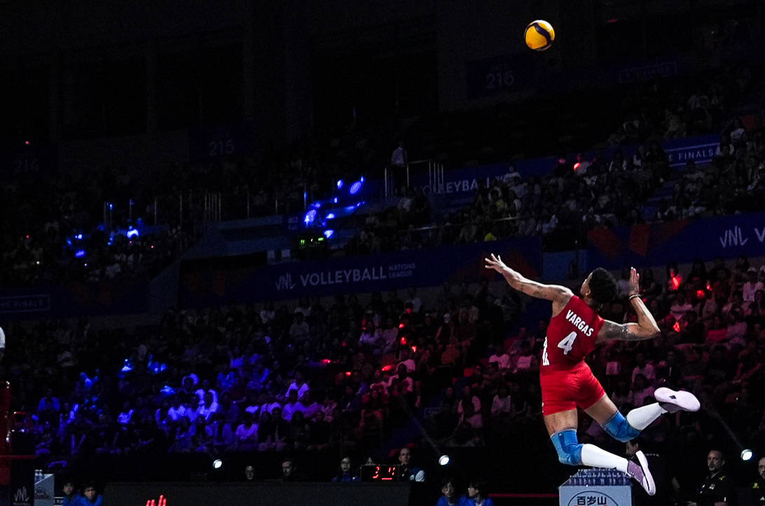 Melissa Vargas hits a jump serve
