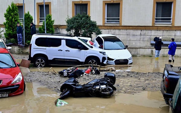 Delivery work amid floods: Both working and stopping have a cost