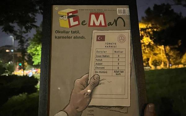 LeMan Dergisi ve karartılmış TV ekranları