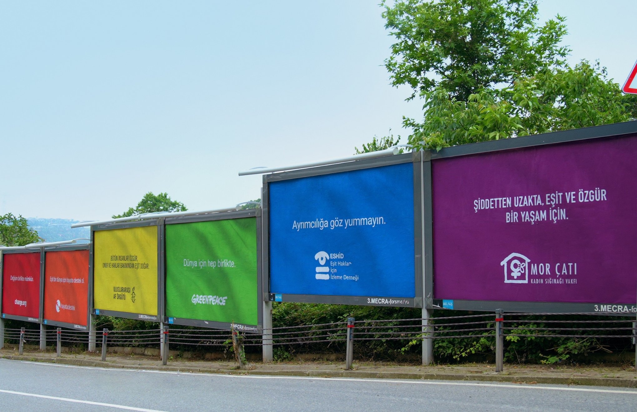 Six NGOs paint billboards in rainbow colors